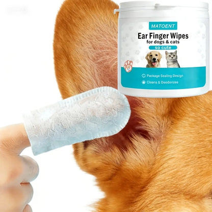 Dog ear cleaning with a white fingertip wipe and pet wipes tub