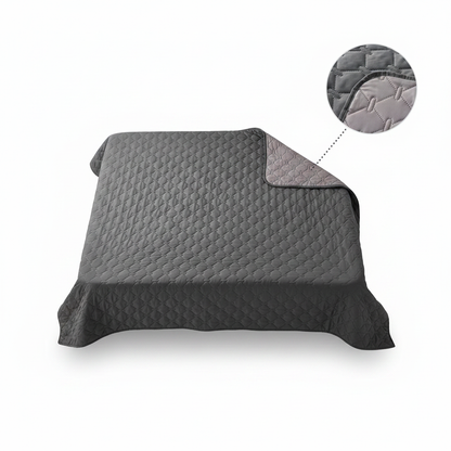 Folded dark gray reversible quilted waterproof pet blanket with texture detail inset