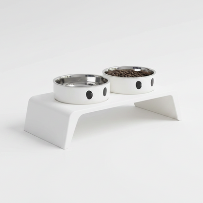 Elevated pet feeder stand with two stainless steel bowls and cat-face cutouts